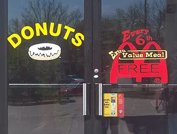 Bright window lettering for a restaurant promotion